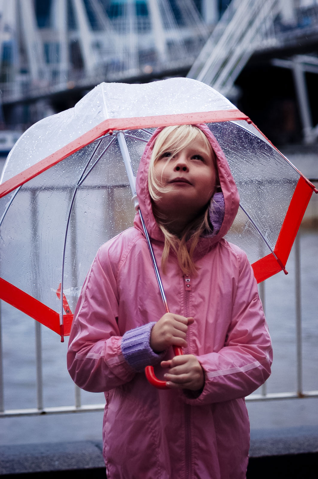 Another bank holiday weekend is forecast for rain. Abbie (8yrs) from Hersham shelters beneath her umbrella.