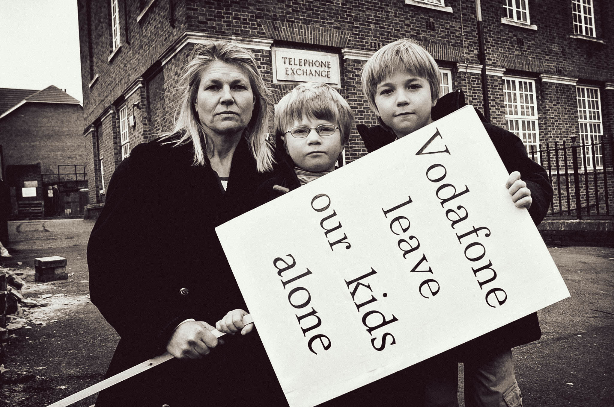 Sarah Purdy with sons outside the telephone exchange building on Grand Avenue, Harringay, where Vodaphone have been granted the right to install mobile phone masts, against the wishes of local residents and parents. Sarah Purdy is active in the campaign against the masts that will be in close proximity to several local schools.