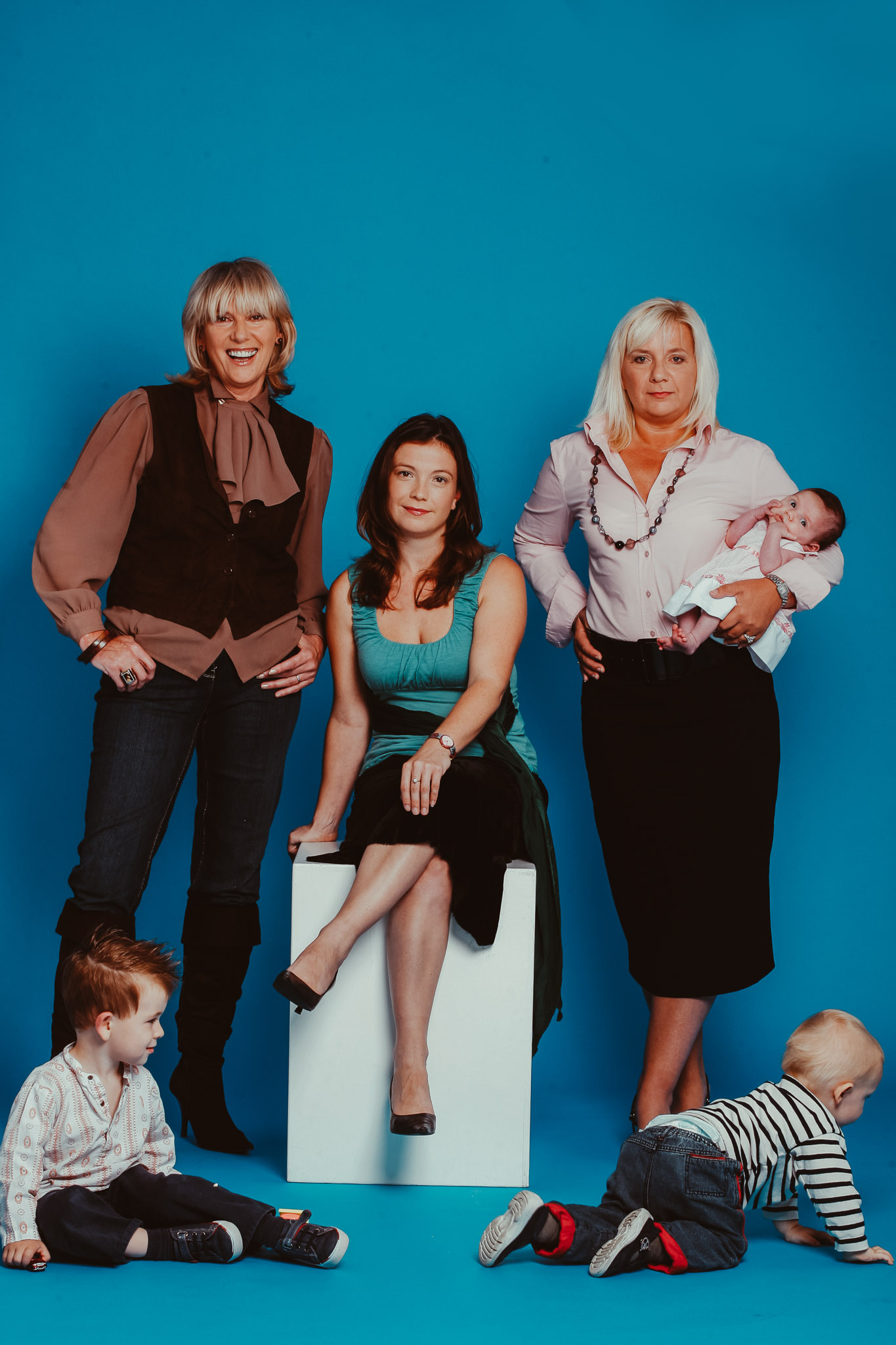 nannies, (from left to right) Dreena Hamilton, Claire Scott and Claire Verity with children William (3yrs), Rudy (18months) and Abbie (7 weeks) in Click Studios, London
