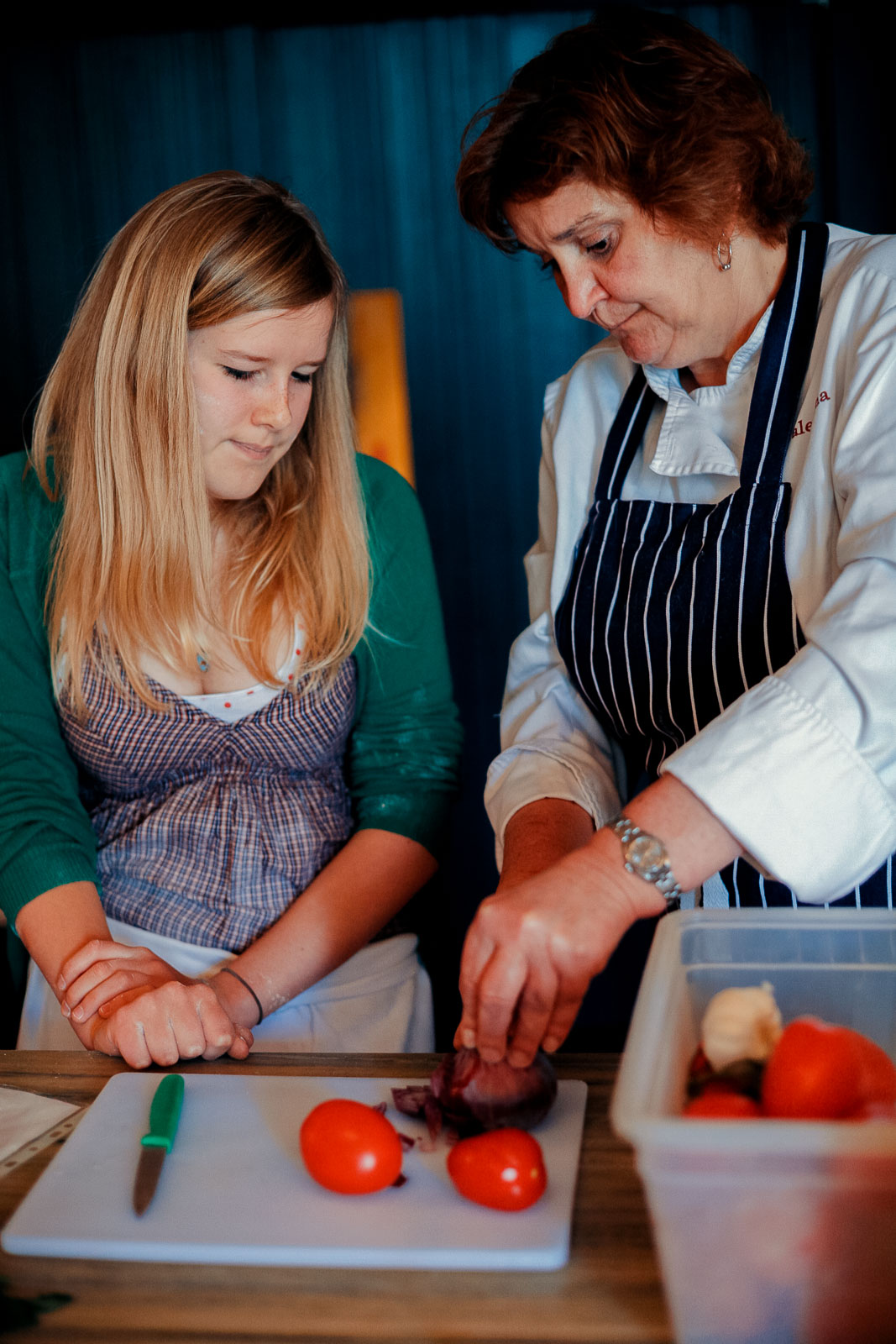Teenagers learning cookery skills at Amici Bar & Italian Kitchen, South London