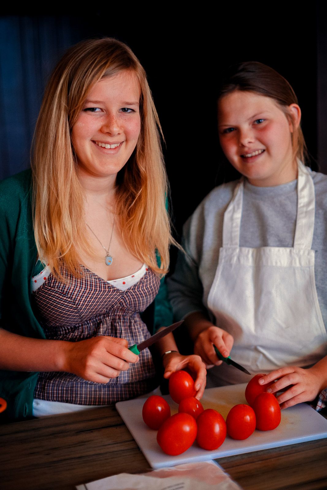 Teenagers learning cookery skills at Amici Bar & Italian Kitchen, South London