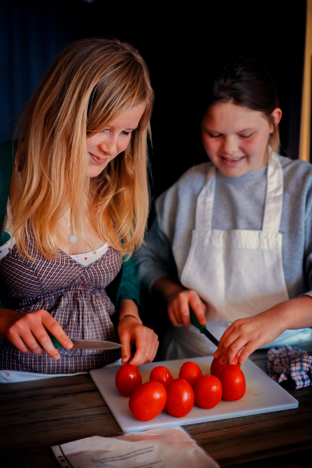 Teenagers learning cookery skills at Amici Bar & Italian Kitchen, South London