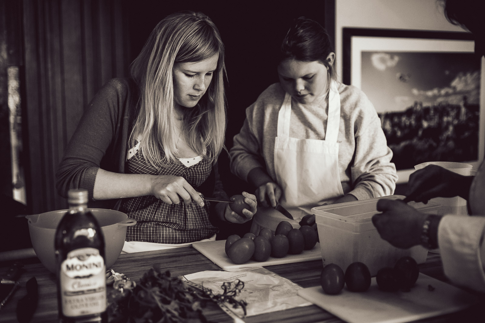 Teenagers learning cookery skills at Amici Bar & Italian Kitchen, South London