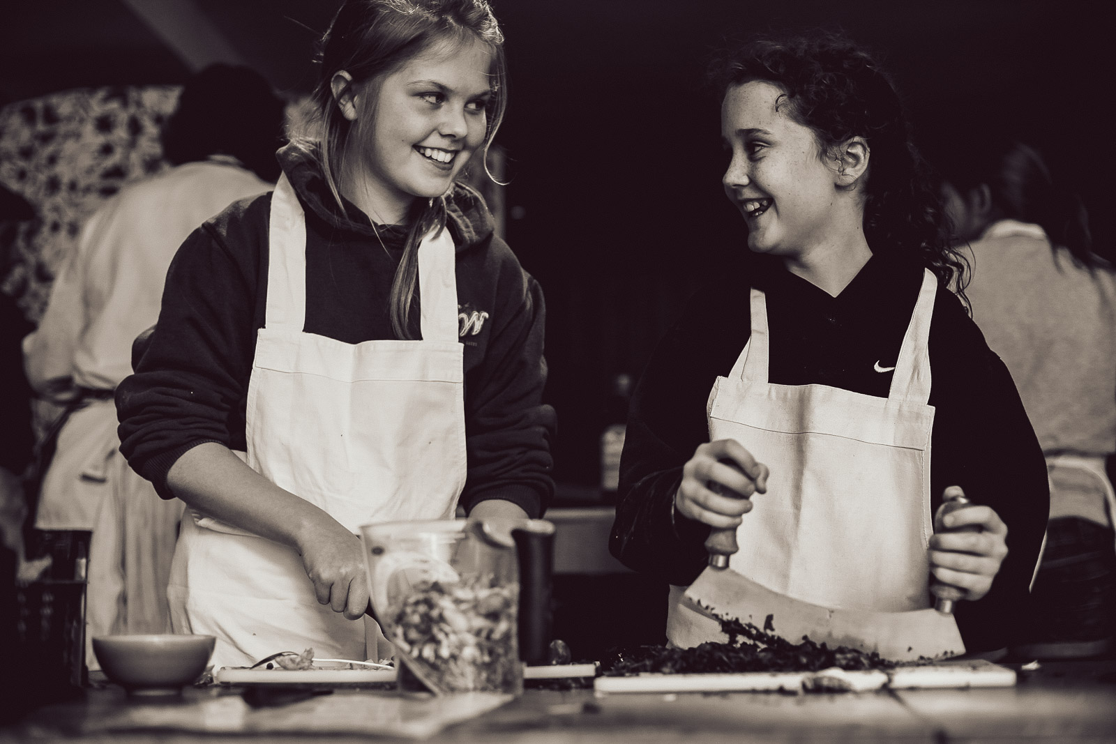 Teenagers learning cookery skills at Amici Bar & Italian Kitchen, South London